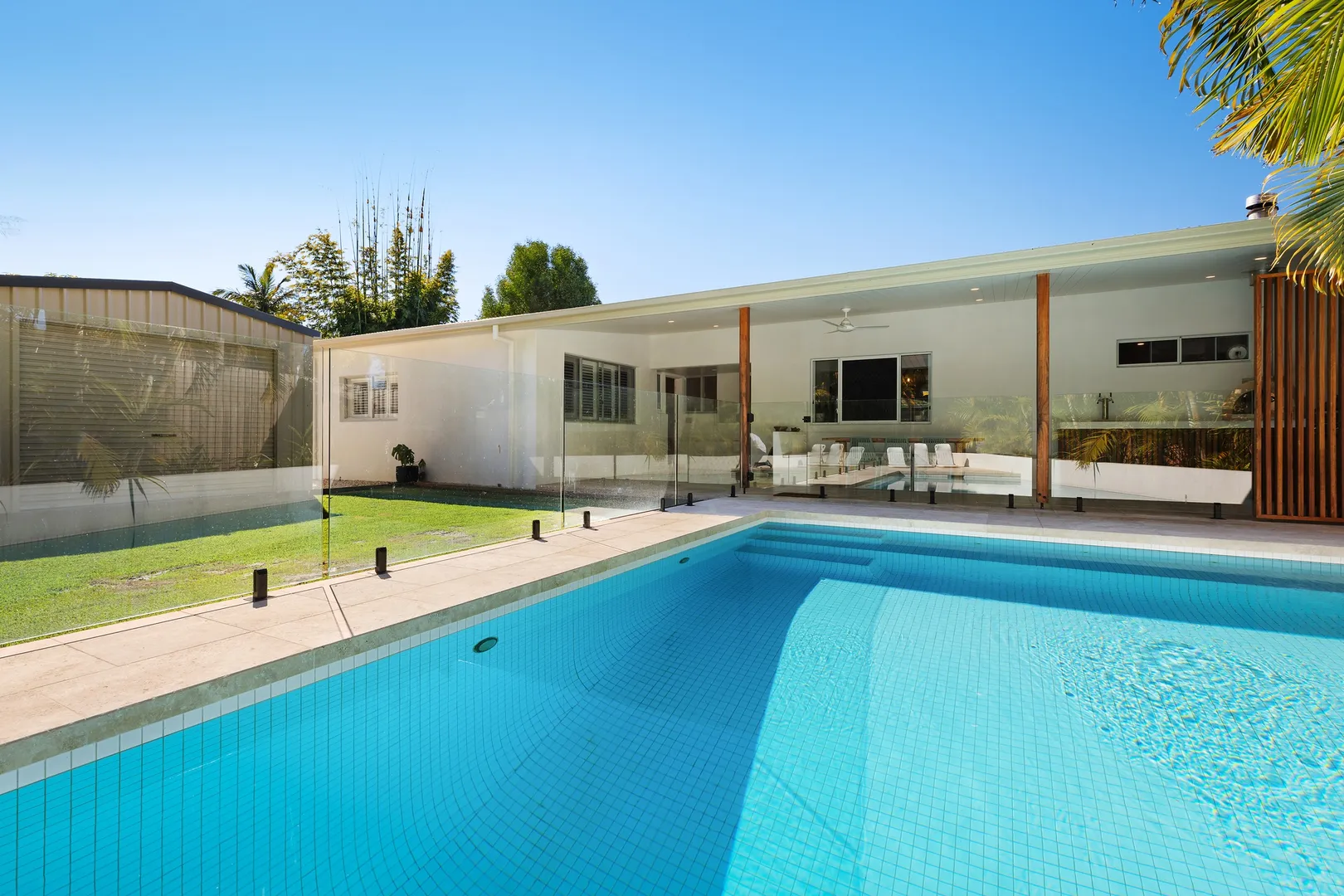 Modern house with a backyard swimming pool.